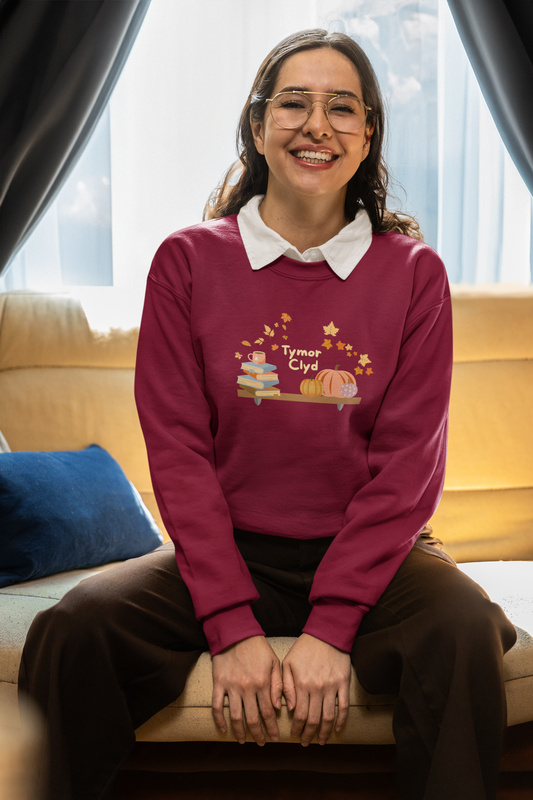 Tymor Clyd (Cosy Season) Welsh language autumn sweatshirt with bookshelf