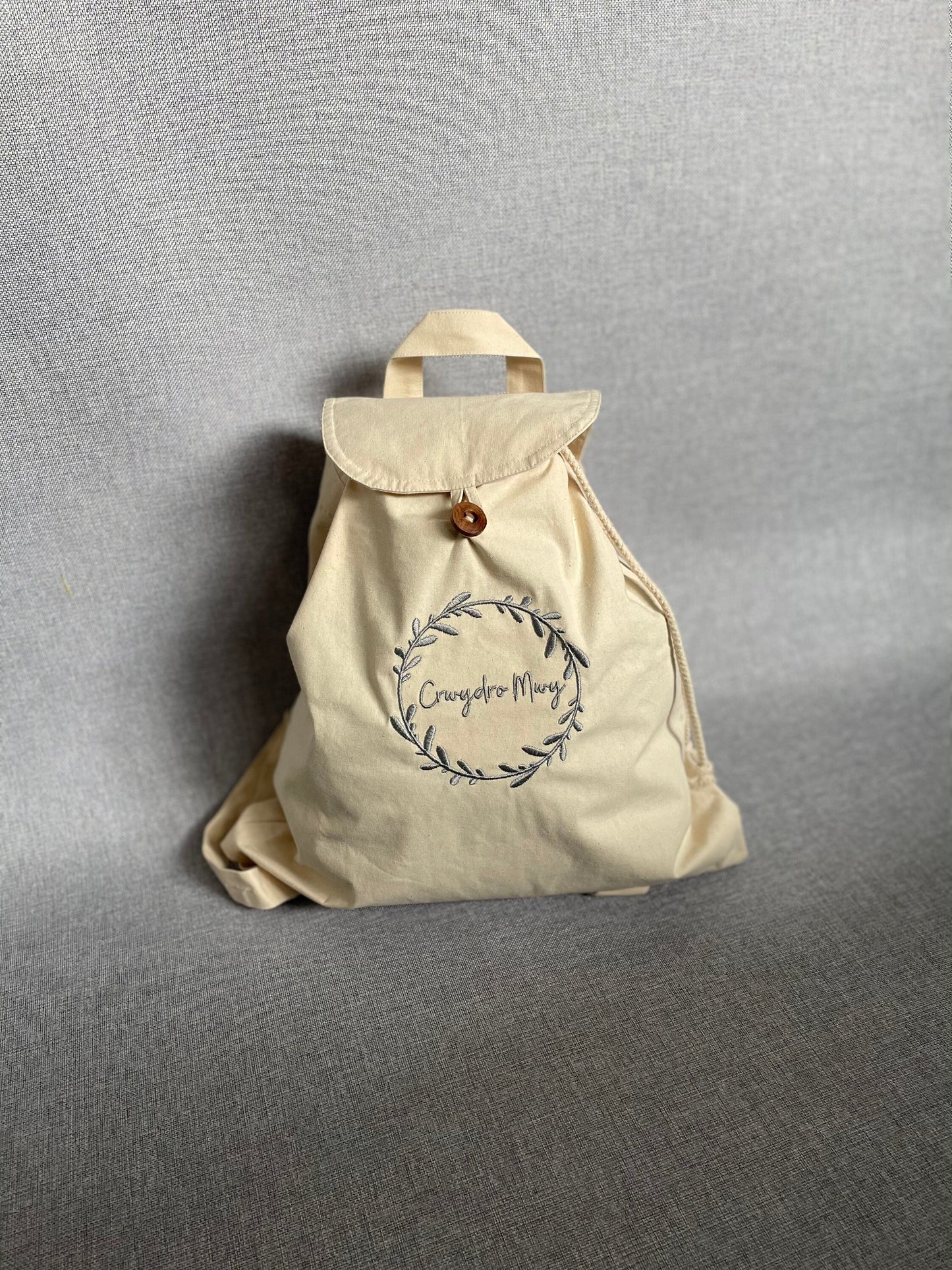 Crwydro Mwy (Wander More) cotton drawstring backpack. Welsh language